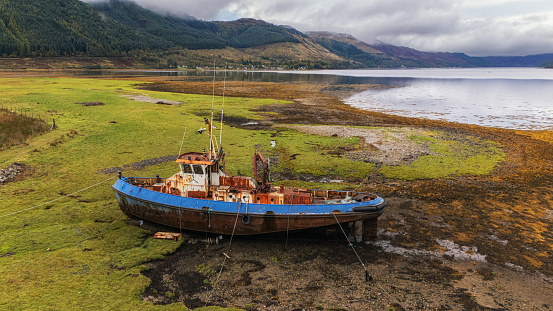 Abandoned and ruined fishing boat in Invershiel Scotland