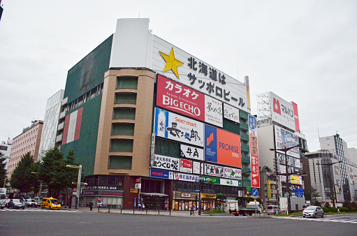 Tourists visit Nakamise Shopping Street outside of Sensoji Temple in Asakusa, Tokyo, Japan