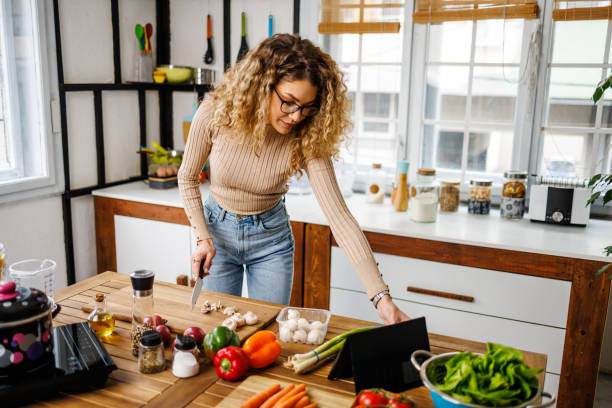 istock Woman watching recipe online 2101479370
