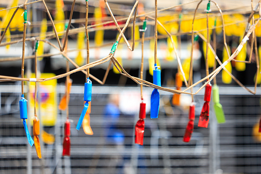 Hanging firecrackers of different colors during the mascleta, a tradition of the city of Valencia. Spain