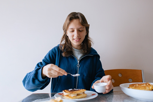 a young girl who eats waffles for breakfast in the morning