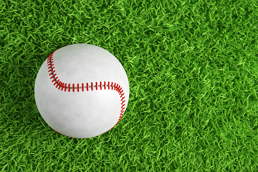 Baseball ball on green grass with copy space. 3d-rendering