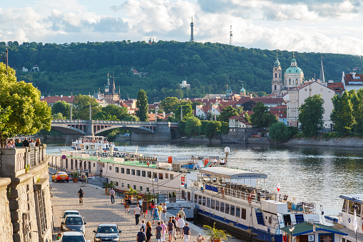 Vltava river, Manes bridge and St Nicholas church in Prague, Czech Republic.