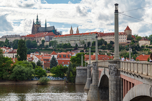 Vltava river, Manes bridge and St Vitus cathedral in Prague, Czech Republic.