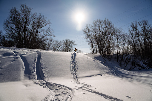 Winter landscape, man skiing downhill, winter adventure, walking in the fresh air. High quality photo