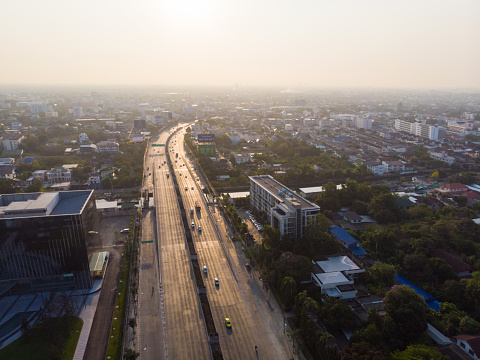 Aerial view office building with city road morning sun rise Bangkok Thailalnd