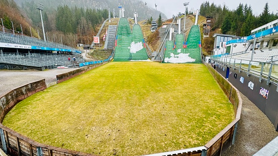 Oberstdorf, Germany - March, 16th - 2024: Schattenberg ski jump arena showing all 5 ski jumps.