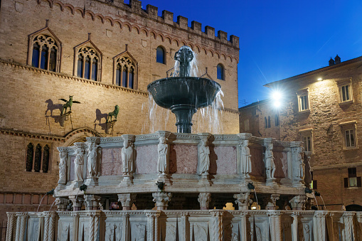 Perugia, Italy - July 26, 2023: Historic buildings of Perugia, Umbria region, Italy: Piazza IV Novembre by night