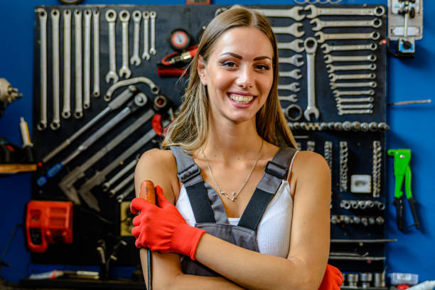 istock Portrait of a Young Woman Auto Servicer with Work Tools. 2101564144