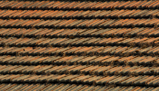 Clay Roof Tiles texture background. Weathered rusty red tiles.
