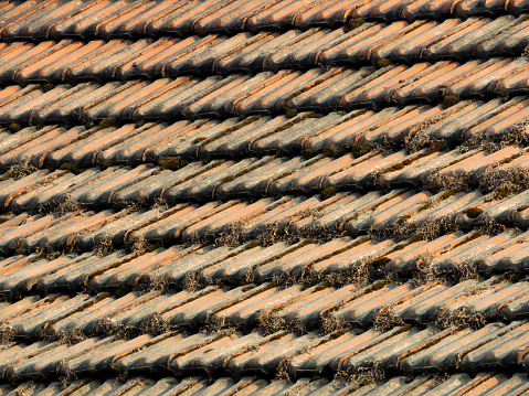 Clay Roof Tiles texture background. Weathered rusty red tiles.
