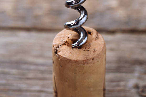 istock Wine cork and corkscrew macro photography. Perfect background for wine and restaurant-related concepts. 2101581075