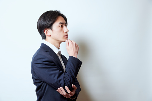 Portrait of a young Japanese businessman wearing a suit