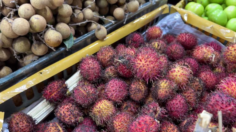 Rambutan Nephelium lappaceum with natural background. Rambutan is the exotic fruit from indonesia. Juicy and sweet. one of the cheapest fruit from Indonesia. word rambut meaning hair