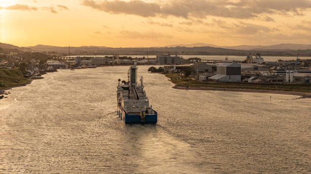 Ship approaching Montrose port at sunset Scotland