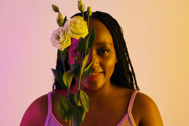 istock Smiling Woman Holding White Roses 2101620319