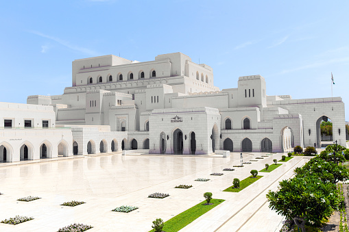 Muscat, Oman - May 27, 2023: Royal Opera House in Muscat with reflections on polished marble floor in front. Sultanate of Oman