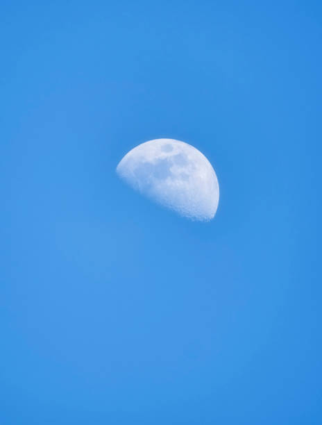 istock moon with craters during the day against a blue sky 2101635166