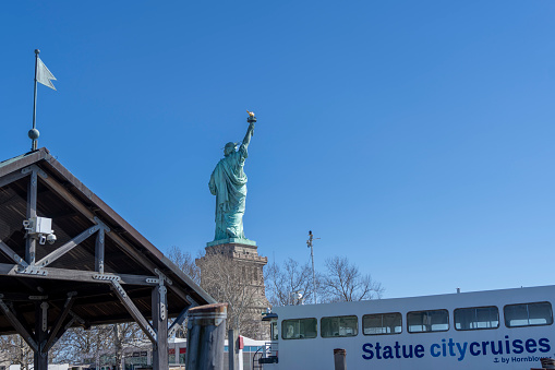 Statue of Liberty on Liberty island viewed from the ferry terminal.