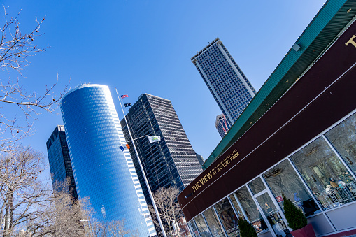 Battery Park, Manhattan, New York, USA - March 2024.  Skyscrapers near the terminal building for the Statue of Liberty cruise to Liberty island this is the Battery park ferry terminal.