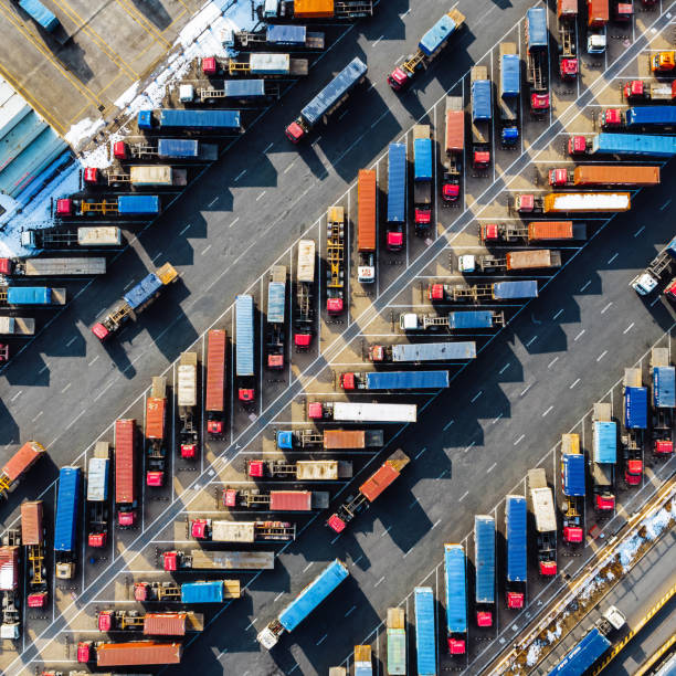 istock Aerial View, Rows of Trucks Driving in Harbor with Trailers 2101679693