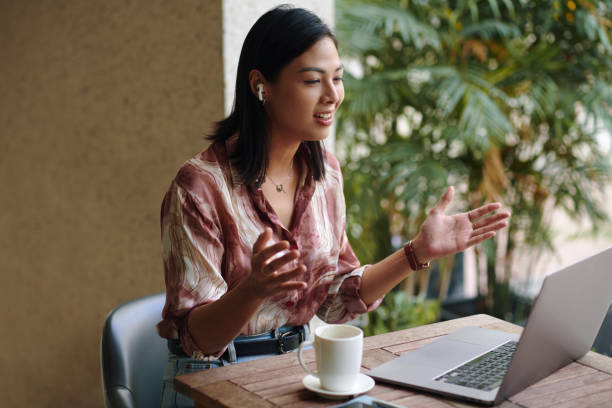 istock Businesswoman Explaining Ideas to Colleagues 2101699443