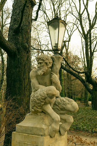 December 26, 2022. Poland Warsaw. Royal Baths Park. Sculpture of a satyr with a lantern. Art.