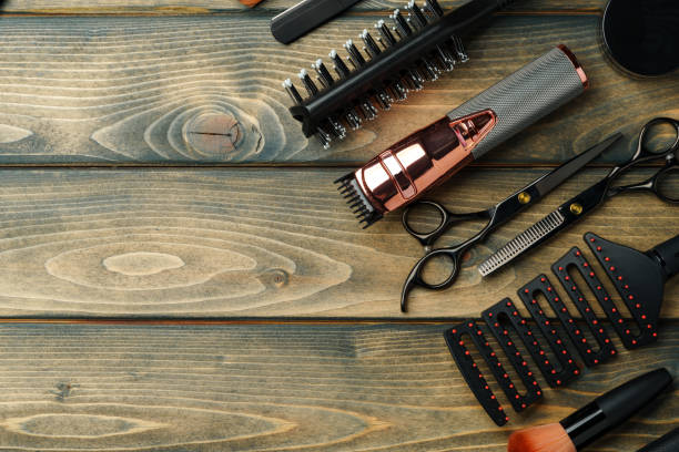 istock Hairdressing barber tools on wooden background close up 2101752428