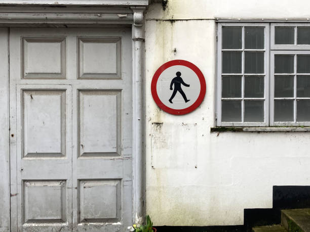 istock A landscape composition featuring a Classical door, pedestrian sign and old window. Diss, Norfolk 2101777341
