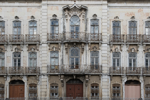 Detailed architectural view of classic historic facade of abandoned palatial building in the centre of Lisbon in Portugal