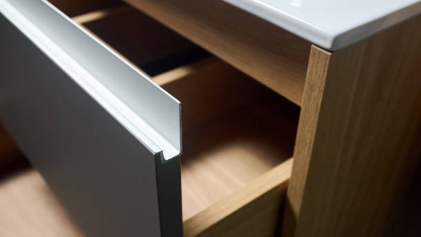 istock Sliding lockers with aluminum extruded G profile handles for bathroom kitchen cabinets. Solutions for placing things in bathroom horizontal sliding pull out drawer shelves storage of cupboard. 2101806514