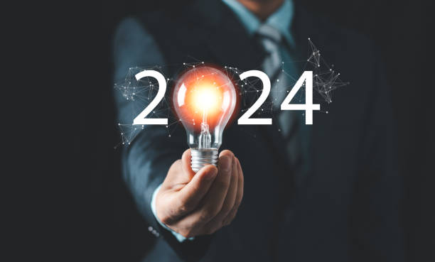 istock 2024 creative concept, business man holding light bulb 2024 numbers, 2024 number for creative thinking idea for start new business concept. 2101836855