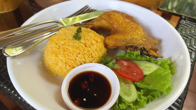 stream chicken with pilau rice on white plate Chicken Teriyaki Food close up establish shot