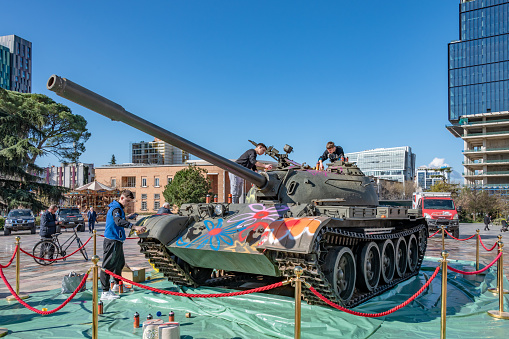 Tirana, Albania. 14 March 2024. An old tank is spray painted with flowers in Albania by young artists.