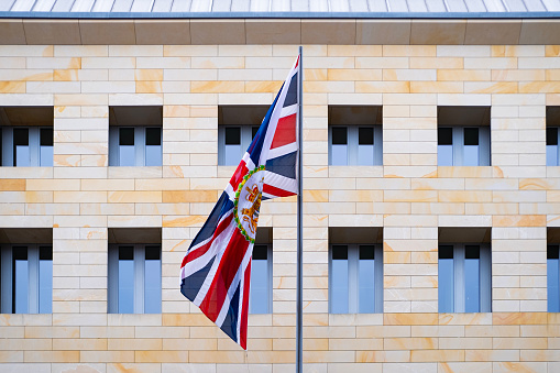 Union Jack flag on wall of British Embassy, Consulate in Berlin, obtaining visa to enter country, naturalization of citizens, economy and politics, diplomatic mission, Berlin, Germany