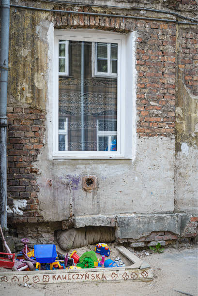istock A neglected sandbox, old toys, a dingy building, a playground 2101866444