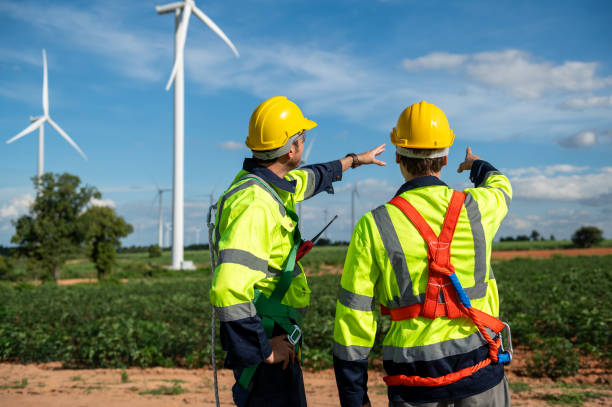istock Engineering people are meeting at electrical turbines field, Engineering people, corporate working, teamwork concept 2101878651