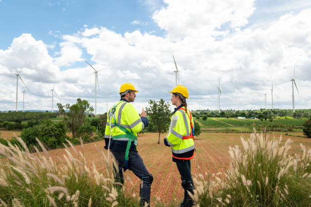 istock Engineering people are meeting at electrical turbines field, Engineering people, corporate working, teamwork concept 2101880227
