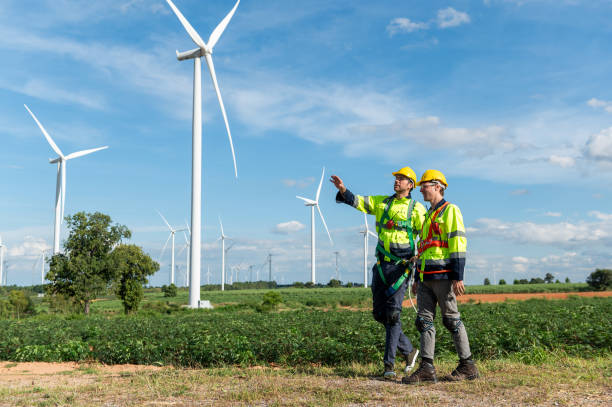istock Engineering people are meeting at electrical turbines field, Engineering people, corporate working, teamwork concept 2101882328