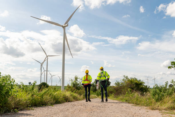 istock Engineering people are meeting at electrical turbines field, Engineering people, corporate working, teamwork concept 2101883371