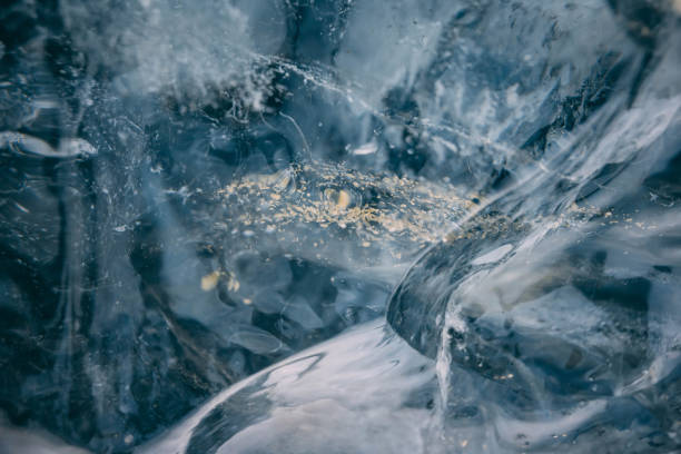 istock Glacial Ice closeup with ancient rock and dust pieces inside. 2101888251