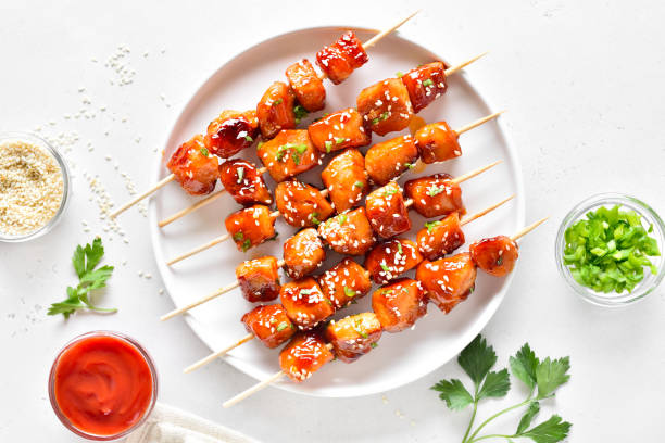 istock Teriyaki chicken skewers on plate 2101903236