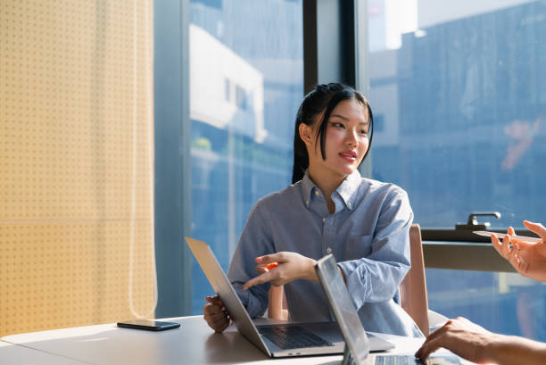 istock Asian woman meeting in office 2101906263