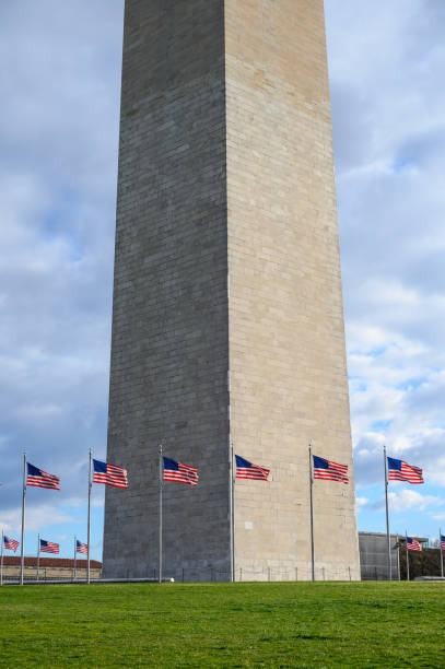 istock The Washington Monument surrounded by American flags 2101918178