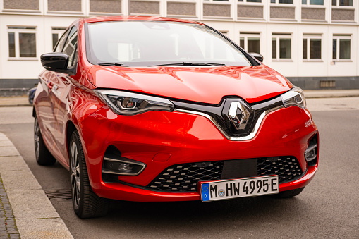 modern red Electric Renault Zoe E-Tech, French multinational automobile manufacturer, EV in urban environment, sustainable development automotive industry, Berlin, Germany - February 18, 2024