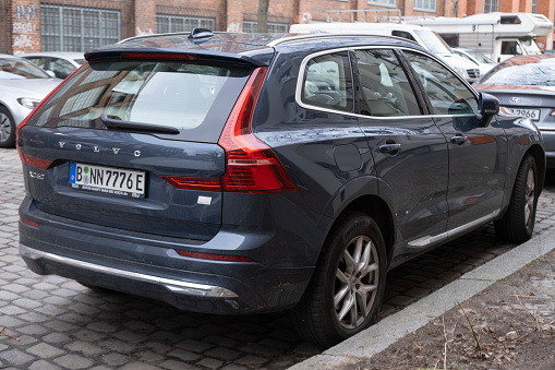 blue Volvo XC60 Recharge Plug-in Hybrid SUV parked on street in Berlin, Swedish car, High Tech Advanced technology in automotive industry, Berlin, Germany - February 18, 2024