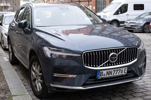 blue Volvo XC60 Recharge Plug-in Hybrid SUV parked on street in Berlin, Swedish car, High Tech Advanced technology in automotive industry, Berlin, Germany - February 18, 2024