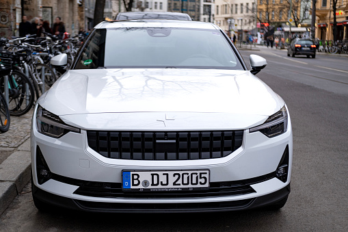 modern white car Polestar 2 on street of Berlin, eco-friendly Electric vehicle in urban environment, automotive industry, sustainable transportation, Berlin, Germany - February 18, 2024