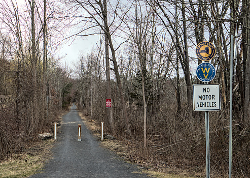 New Paltz, New York - Mar 17, 2024: Empire State Trail sign on the Wallkill Valley rail trail bike path in New York State.