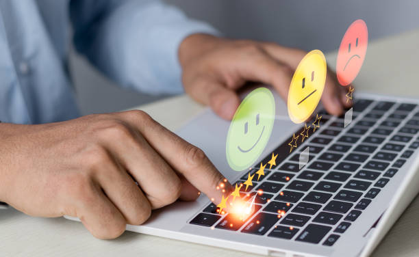 istock Customer service evaluation concept. businessman pressing face on a virtual touch screen at a laptop, feeling satisfied, high score, good review, impressed, Customer Satisfaction Survey Concept. 2102004070